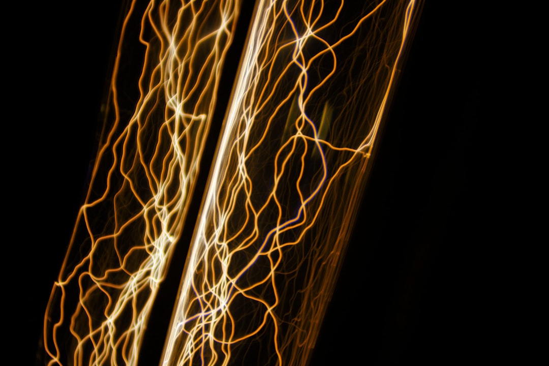 Abstract visualization of glowing nodes connected by bright lines on a dark background, representing the interconnected to...